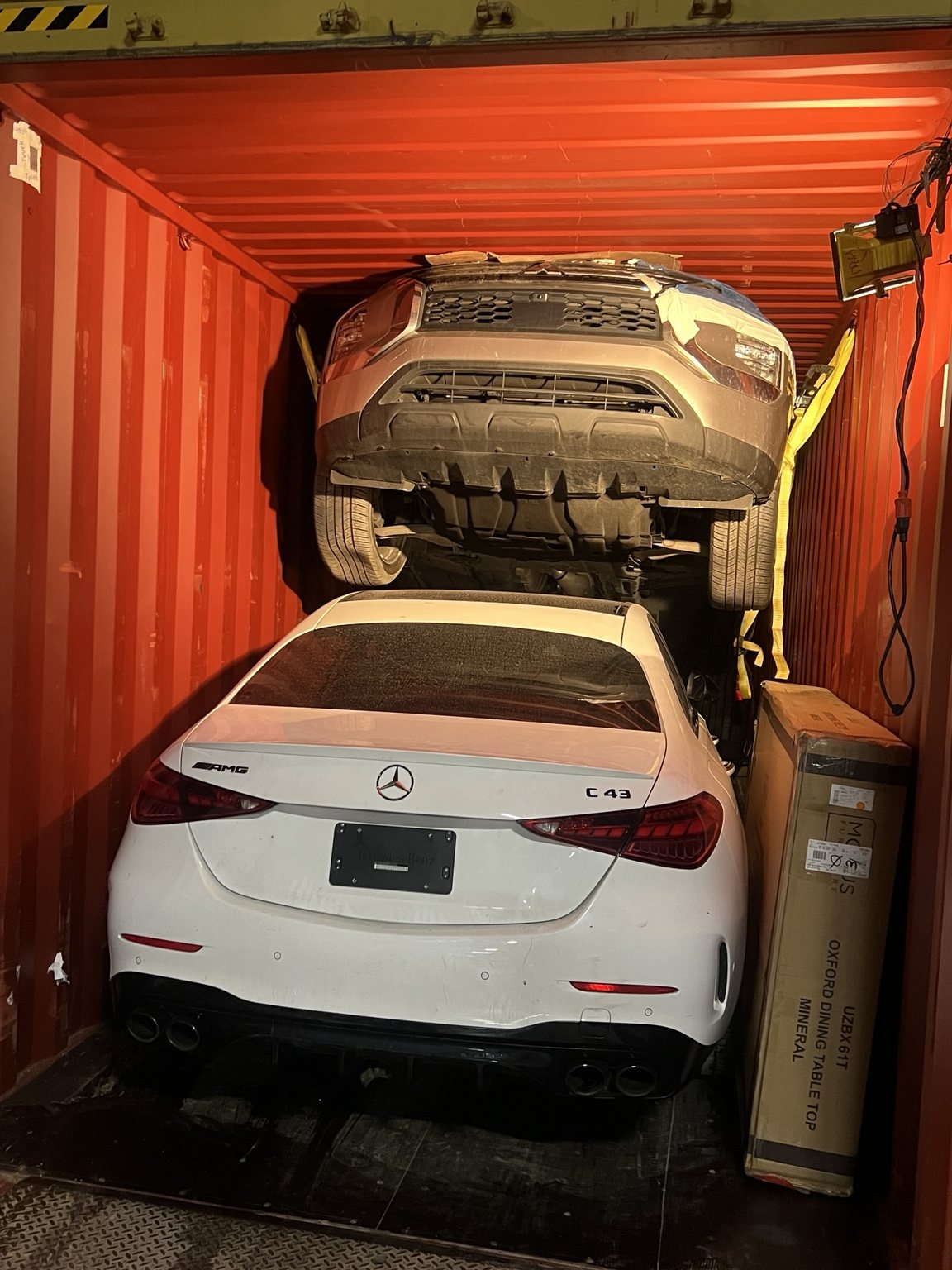 Vehicles loaded inside a shipping container