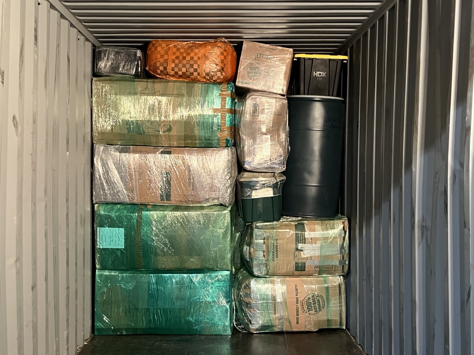 Boxes and barrels loaded in container